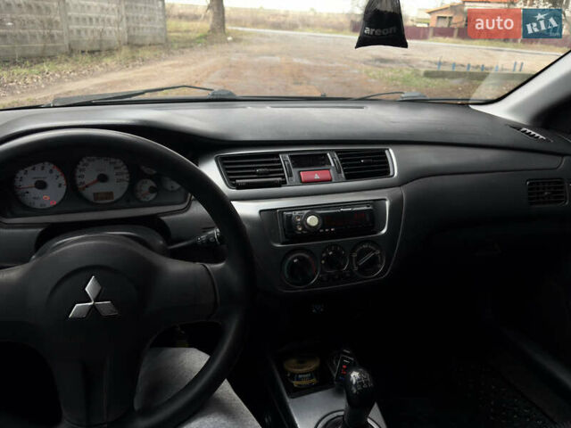 Чорний Міцубісі Lancer, об'ємом двигуна 1.58 л та пробігом 210 тис. км за 3900 $, фото 19 на Automoto.ua