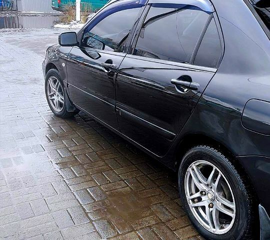 Чорний Міцубісі Lancer, об'ємом двигуна 1.6 л та пробігом 294 тис. км за 4400 $, фото 2 на Automoto.ua