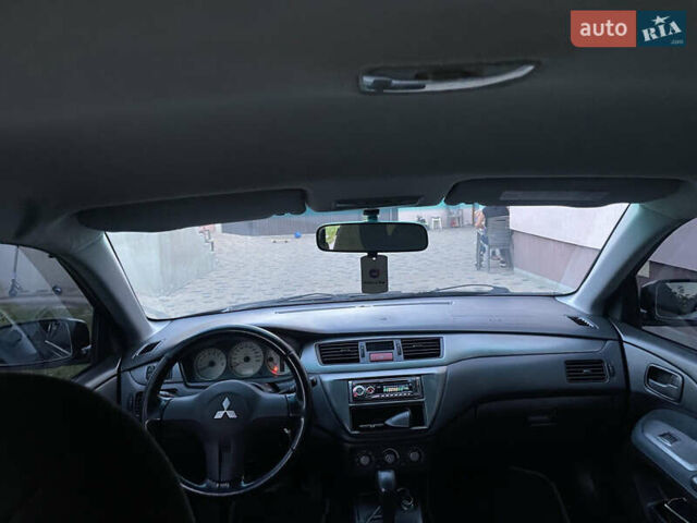Чорний Міцубісі Lancer, об'ємом двигуна 1.6 л та пробігом 170 тис. км за 4900 $, фото 8 на Automoto.ua