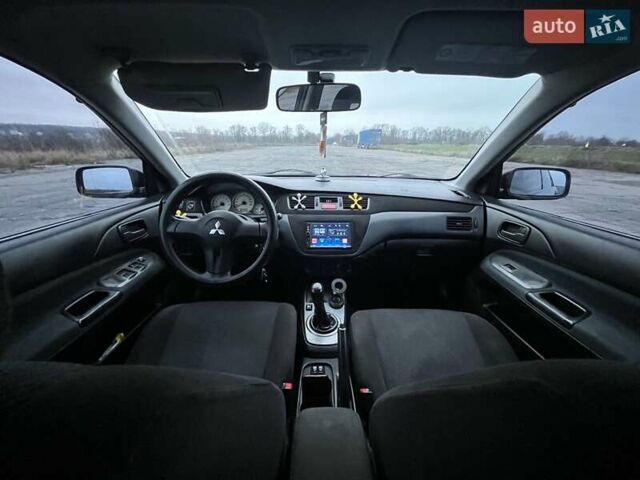 Чорний Міцубісі Lancer, об'ємом двигуна 1.58 л та пробігом 282 тис. км за 4100 $, фото 10 на Automoto.ua