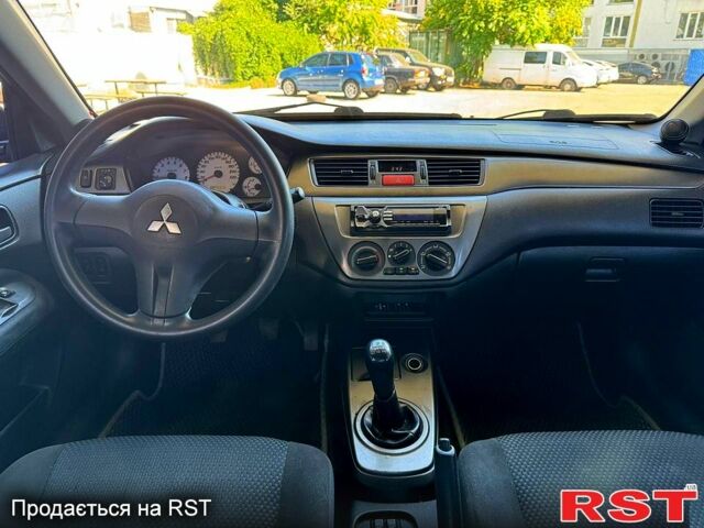 Чорний Міцубісі Lancer, об'ємом двигуна 1.6 л та пробігом 176 тис. км за 3777 $, фото 6 на Automoto.ua