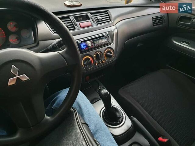 Чорний Міцубісі Lancer, об'ємом двигуна 1.58 л та пробігом 222 тис. км за 2999 $, фото 18 на Automoto.ua