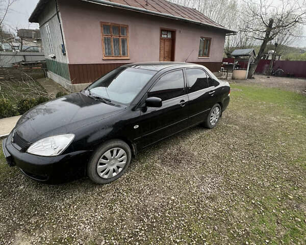 Черный Мицубиси Лансер, объемом двигателя 1.6 л и пробегом 172 тыс. км за 4500 $, фото 4 на Automoto.ua