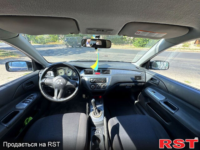 Черный Мицубиси Лансер, объемом двигателя 1.6 л и пробегом 300 тыс. км за 3599 $, фото 10 на Automoto.ua