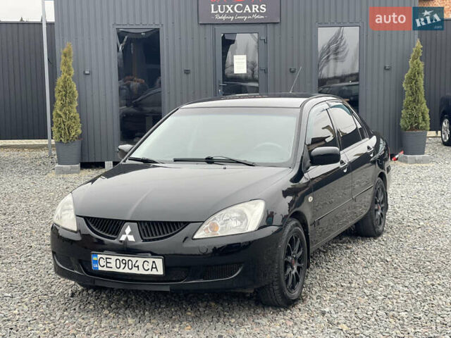 Чорний Міцубісі Lancer, об'ємом двигуна 1.58 л та пробігом 230 тис. км за 3350 $, фото 14 на Automoto.ua