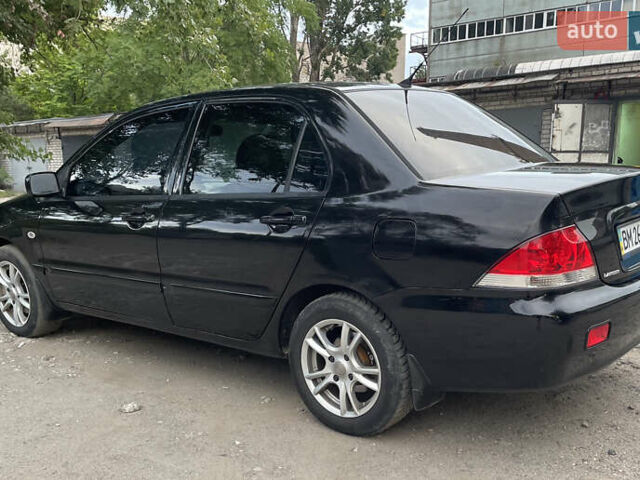 Чорний Міцубісі Lancer, об'ємом двигуна 1.6 л та пробігом 240 тис. км за 4599 $, фото 7 на Automoto.ua