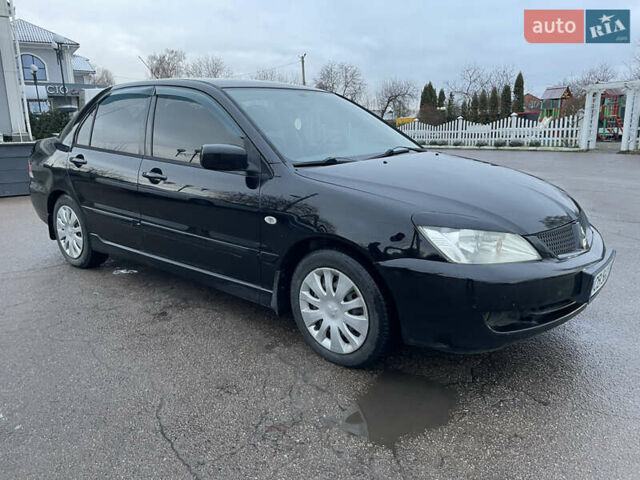 Чорний Міцубісі Lancer, об'ємом двигуна 1.58 л та пробігом 196 тис. км за 3800 $, фото 11 на Automoto.ua