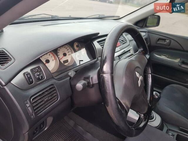 Чорний Міцубісі Lancer, об'ємом двигуна 1.58 л та пробігом 290 тис. км за 3200 $, фото 16 на Automoto.ua