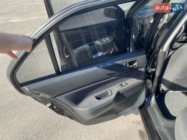 Чорний Міцубісі Lancer, об'ємом двигуна 1.58 л та пробігом 236 тис. км за 4500 $, фото 8 на Automoto.ua