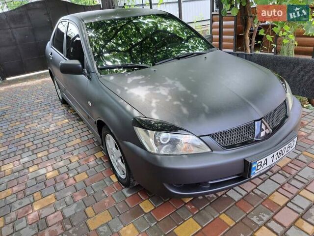 Чорний Міцубісі Lancer, об'ємом двигуна 1.58 л та пробігом 280 тис. км за 3950 $, фото 3 на Automoto.ua