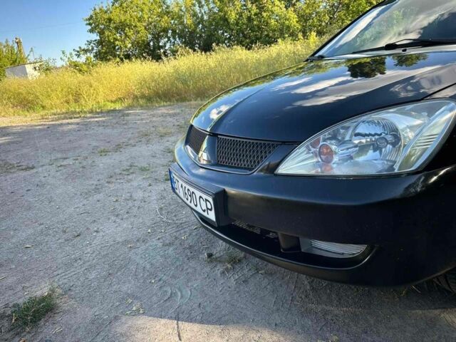 Черный Мицубиси Лансер, объемом двигателя 1.6 л и пробегом 289 тыс. км за 3200 $, фото 13 на Automoto.ua