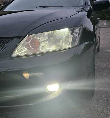 Чорний Міцубісі Lancer, об'ємом двигуна 1.6 л та пробігом 350 тис. км за 4950 $, фото 7 на Automoto.ua