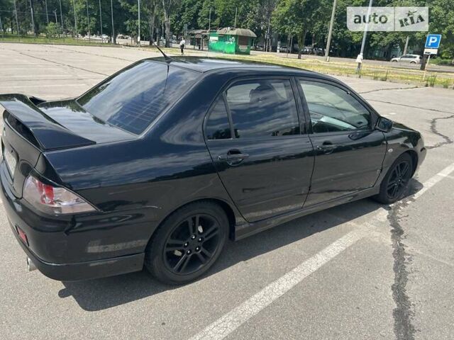 Чорний Міцубісі Lancer, об'ємом двигуна 2 л та пробігом 188 тис. км за 5999 $, фото 4 на Automoto.ua