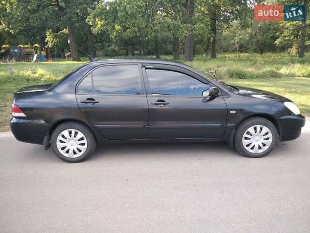 Чорний Міцубісі Lancer, об'ємом двигуна 1.58 л та пробігом 520 тис. км за 3400 $, фото 7 на Automoto.ua