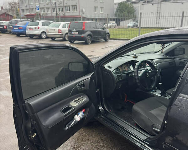 Черный Мицубиси Лансер, объемом двигателя 1.6 л и пробегом 368 тыс. км за 3200 $, фото 6 на Automoto.ua