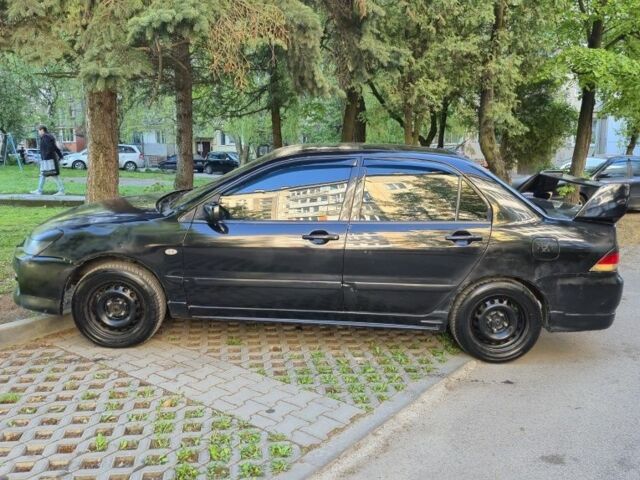 Чорний Міцубісі Lancer, об'ємом двигуна 1.6 л та пробігом 260 тис. км за 2500 $, фото 3 на Automoto.ua