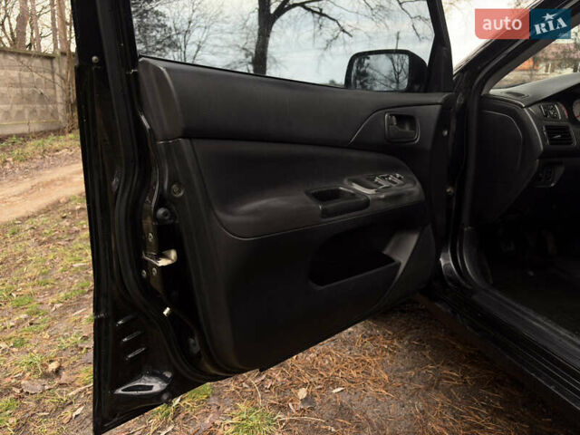 Чорний Міцубісі Lancer, об'ємом двигуна 1.58 л та пробігом 210 тис. км за 3900 $, фото 10 на Automoto.ua
