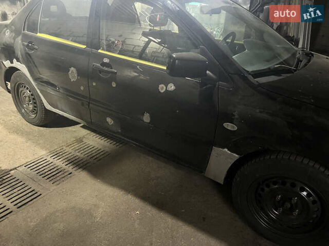 Черный Мицубиси Лансер, объемом двигателя 1.58 л и пробегом 250 тыс. км за 2450 $, фото 7 на Automoto.ua