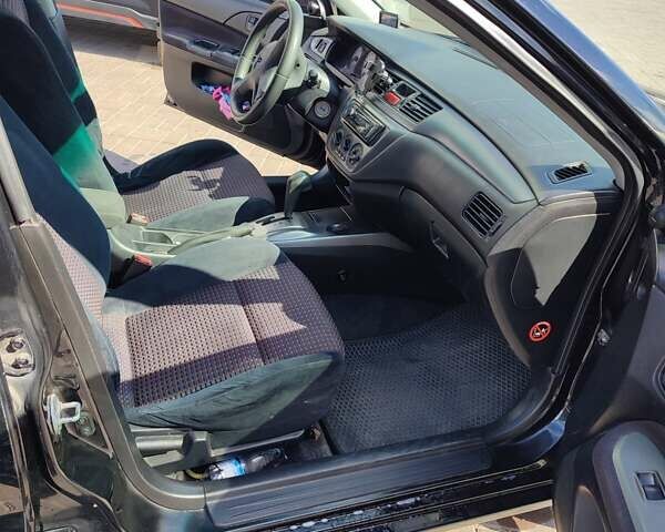 Чорний Міцубісі Lancer, об'ємом двигуна 1.58 л та пробігом 128 тис. км за 4600 $, фото 15 на Automoto.ua