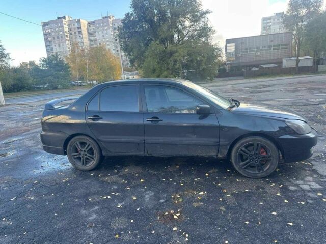 Черный Мицубиси Лансер, объемом двигателя 2 л и пробегом 200 тыс. км за 2999 $, фото 2 на Automoto.ua