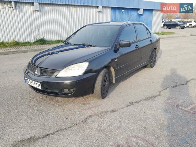 Чорний Міцубісі Lancer, об'ємом двигуна 1.58 л та пробігом 290 тис. км за 3200 $, фото 7 на Automoto.ua