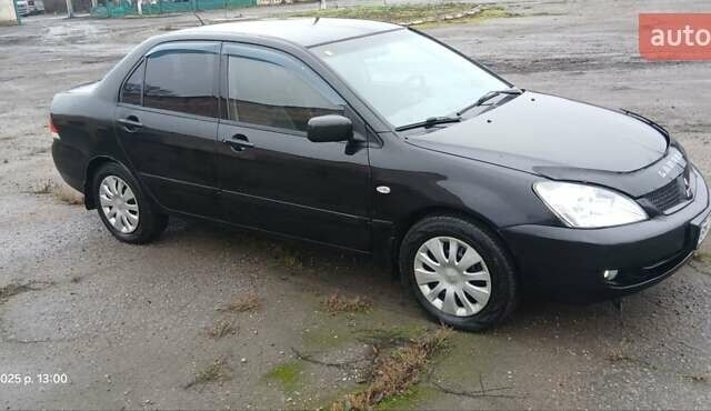 Чорний Міцубісі Lancer, об'ємом двигуна 1.6 л та пробігом 230 тис. км за 3250 $, фото 1 на Automoto.ua