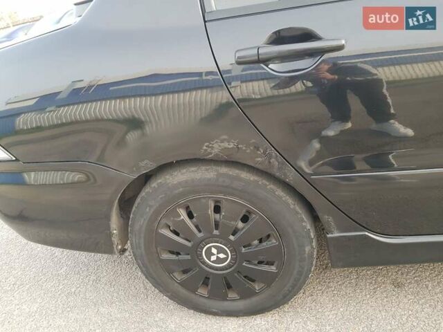 Чорний Міцубісі Lancer, об'ємом двигуна 1.58 л та пробігом 290 тис. км за 3200 $, фото 21 на Automoto.ua