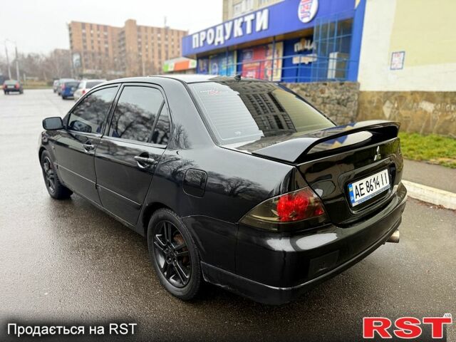 Черный Мицубиси Лансер, объемом двигателя 2 л и пробегом 180 тыс. км за 2800 $, фото 5 на Automoto.ua