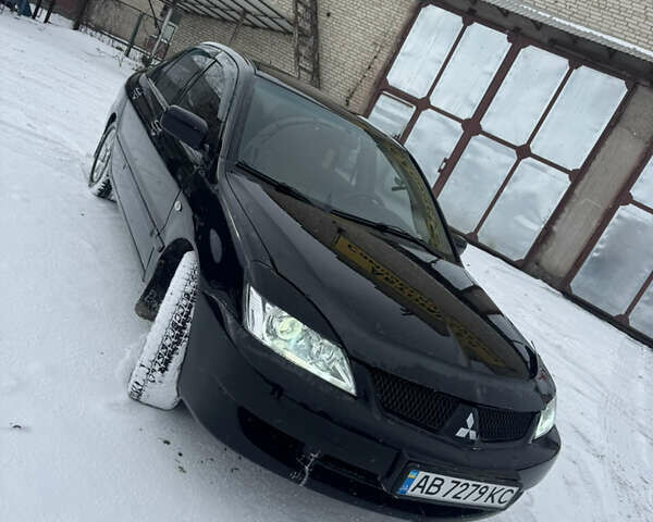Чорний Міцубісі Lancer, об'ємом двигуна 1.58 л та пробігом 340 тис. км за 3550 $, фото 1 на Automoto.ua