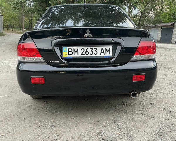 Чорний Міцубісі Lancer, об'ємом двигуна 1.6 л та пробігом 240 тис. км за 4599 $, фото 6 на Automoto.ua