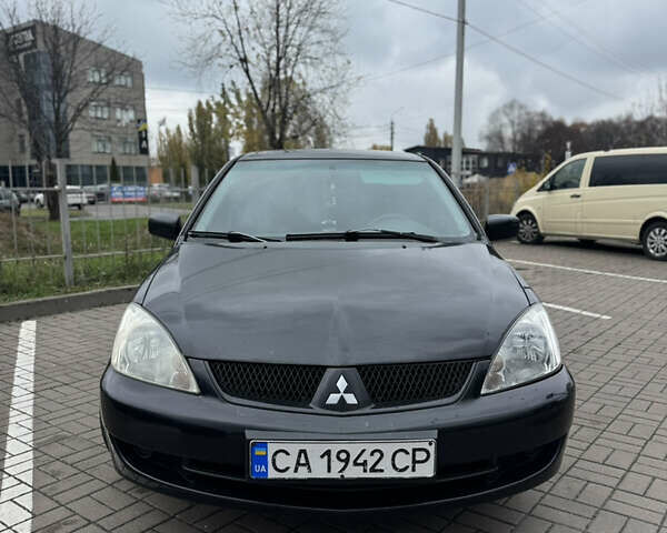 Черный Мицубиси Лансер, объемом двигателя 1.58 л и пробегом 370 тыс. км за 3500 $, фото 1 на Automoto.ua