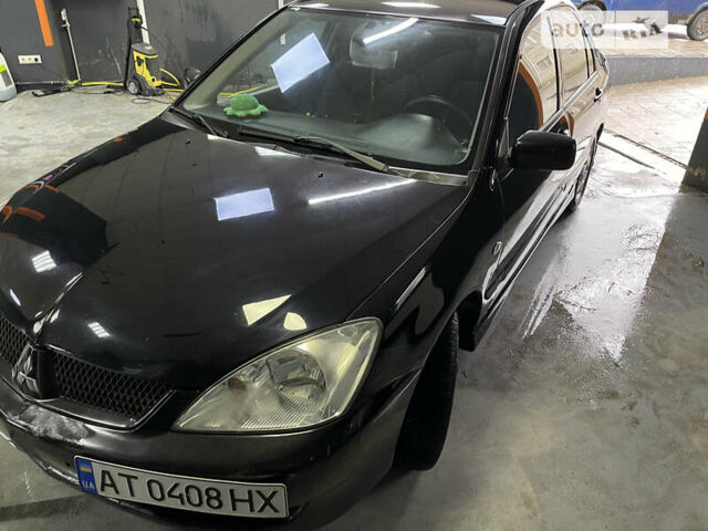 Чорний Міцубісі Lancer, об'ємом двигуна 1.58 л та пробігом 285 тис. км за 4300 $, фото 5 на Automoto.ua