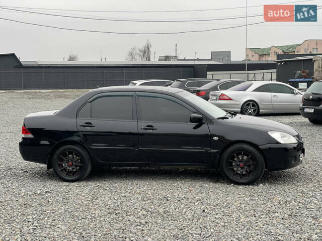 Чорний Міцубісі Lancer, об'ємом двигуна 1.58 л та пробігом 230 тис. км за 3350 $, фото 5 на Automoto.ua