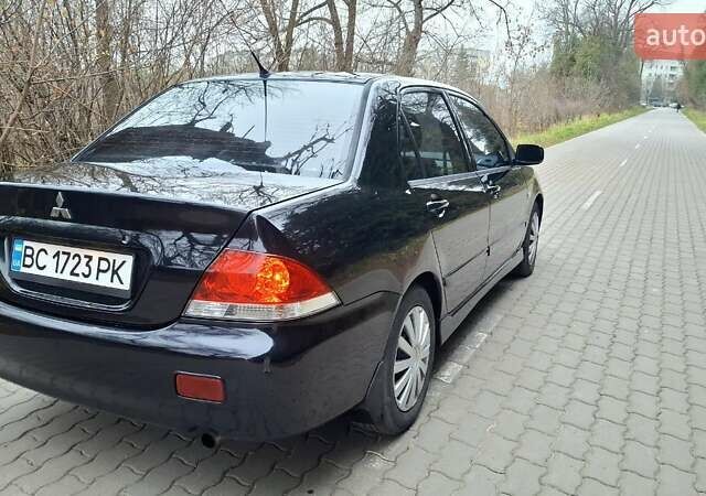 Черный Мицубиси Лансер, объемом двигателя 1.58 л и пробегом 246 тыс. км за 4200 $, фото 4 на Automoto.ua