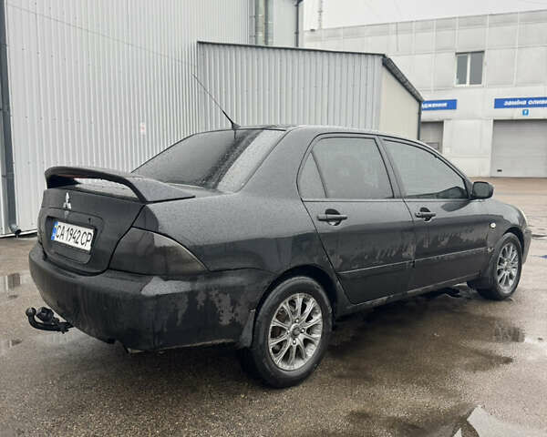 Черный Мицубиси Лансер, объемом двигателя 1.6 л и пробегом 368 тыс. км за 3200 $, фото 3 на Automoto.ua