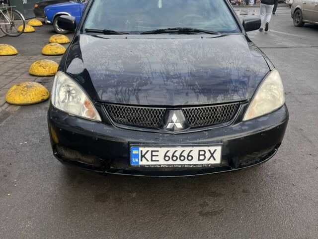 Черный Мицубиси Лансер, объемом двигателя 1.6 л и пробегом 299 тыс. км за 3480 $, фото 1 на Automoto.ua