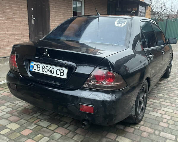 Чорний Міцубісі Lancer, об'ємом двигуна 1.59 л та пробігом 305 тис. км за 2950 $, фото 15 на Automoto.ua