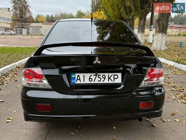 Чорний Міцубісі Lancer, об'ємом двигуна 1.58 л та пробігом 386 тис. км за 4450 $, фото 4 на Automoto.ua