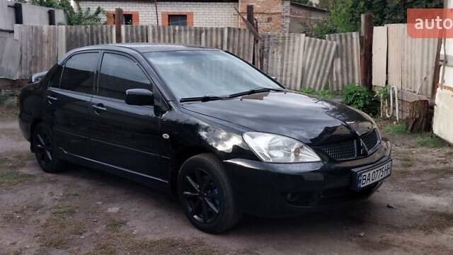 Чорний Міцубісі Lancer, об'ємом двигуна 1.59 л та пробігом 185 тис. км за 4900 $, фото 7 на Automoto.ua