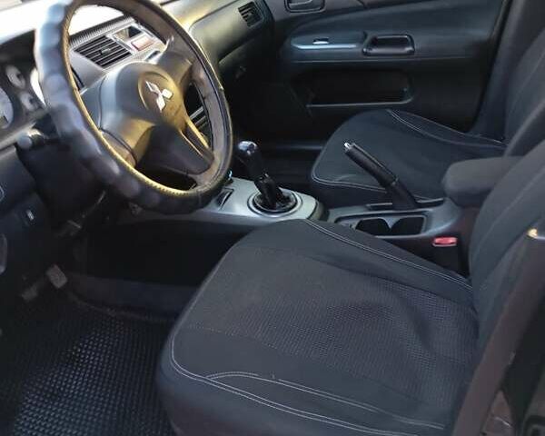 Чорний Міцубісі Lancer, об'ємом двигуна 1.6 л та пробігом 325 тис. км за 4750 $, фото 14 на Automoto.ua