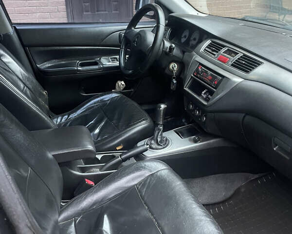 Чорний Міцубісі Lancer, об'ємом двигуна 1.59 л та пробігом 305 тис. км за 2950 $, фото 14 на Automoto.ua