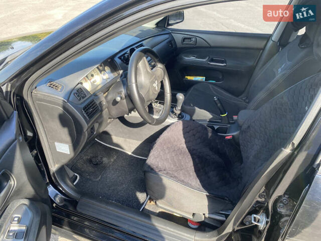 Чорний Міцубісі Lancer, об'ємом двигуна 1.58 л та пробігом 236 тис. км за 4500 $, фото 5 на Automoto.ua