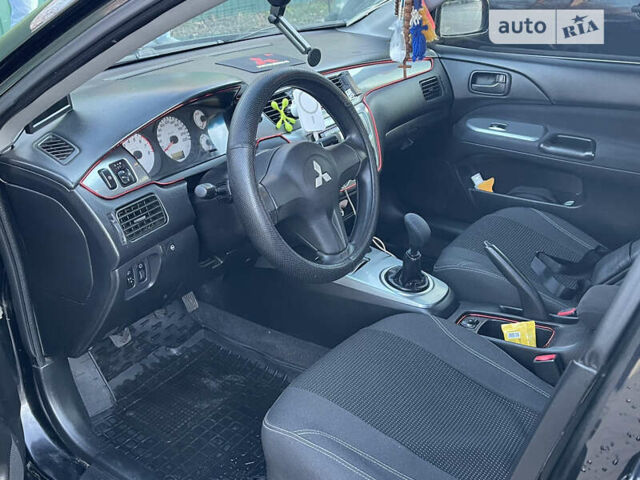Чорний Міцубісі Lancer, об'ємом двигуна 1.58 л та пробігом 256 тис. км за 5350 $, фото 5 на Automoto.ua