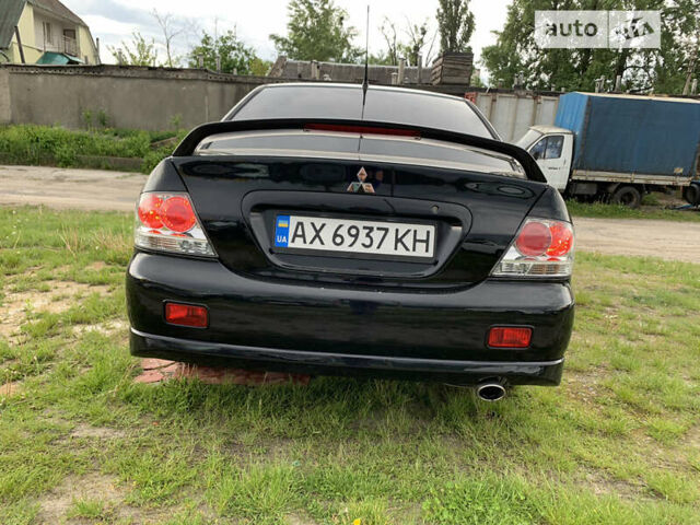 Чорний Міцубісі Lancer, об'ємом двигуна 2 л та пробігом 283 тис. км за 5000 $, фото 6 на Automoto.ua