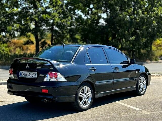 Чорний Міцубісі Lancer, об'ємом двигуна 2 л та пробігом 0 тис. км за 3500 $, фото 3 на Automoto.ua