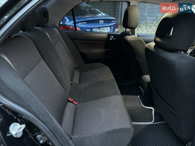 Черный Мицубиси Лансер, объемом двигателя 2 л и пробегом 255 тыс. км за 5000 $, фото 8 на Automoto.ua