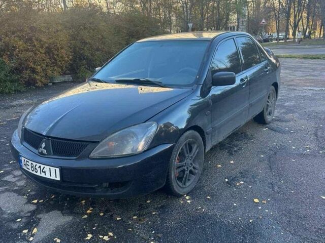 Черный Мицубиси Лансер, объемом двигателя 2 л и пробегом 200 тыс. км за 2999 $, фото 1 на Automoto.ua