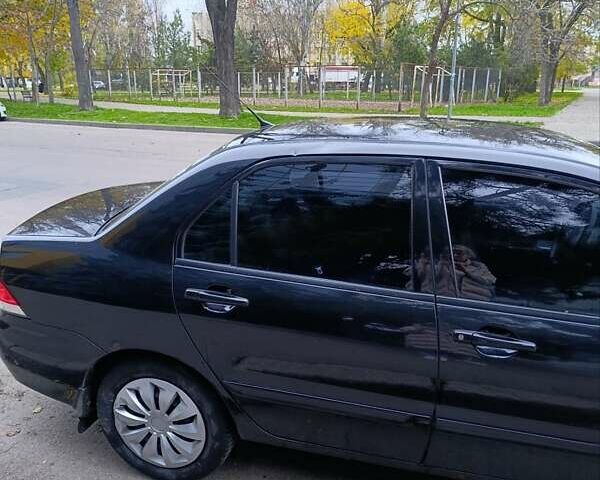 Чорний Міцубісі Lancer, об'ємом двигуна 1.6 л та пробігом 218 тис. км за 4300 $, фото 10 на Automoto.ua