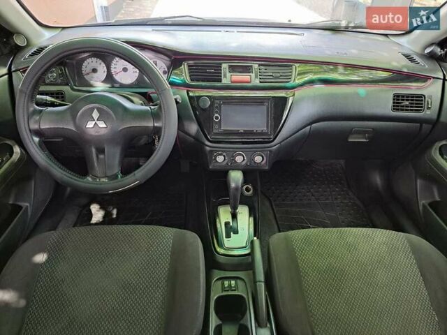 Чорний Міцубісі Lancer, об'ємом двигуна 1.58 л та пробігом 280 тис. км за 3950 $, фото 11 на Automoto.ua