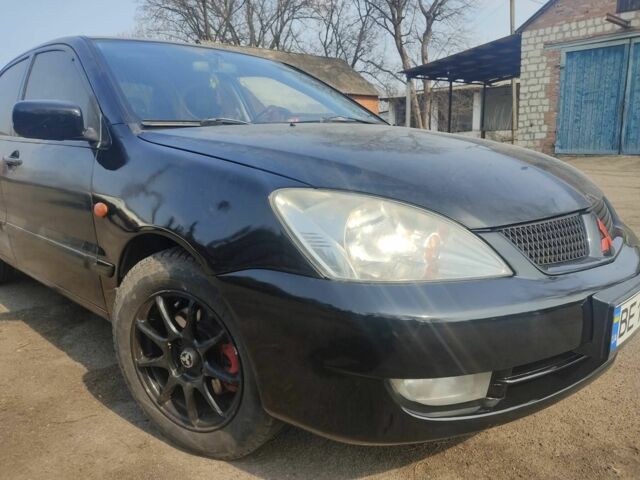 Черный Мицубиси Лансер, объемом двигателя 1.6 л и пробегом 260 тыс. км за 3800 $, фото 2 на Automoto.ua